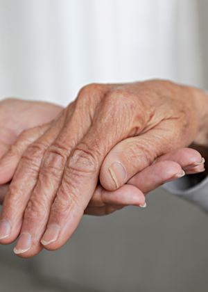 elderly hands holding caringly